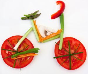 A picture of a bicycle made of vegetables to promote exercise and the Mediterranean diet as part of type 2 diabetes dietary choices,.