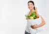happy-woman-holds-fruit-and-vegetable