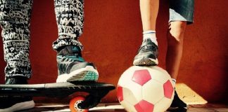 children with skateboard and soccer ball