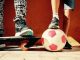 children with skateboard and soccer ball
