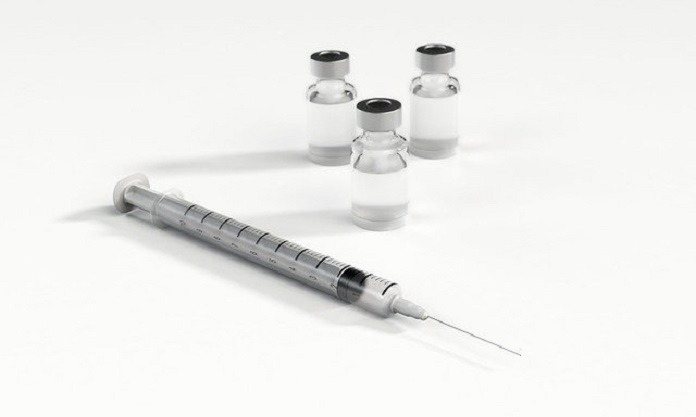 syringe and vials of solution