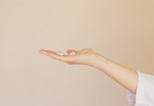 picture of hand holding pills