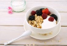 An image of a bowl of yogurt with fruit and granola to display foods that can be good for the microbiome.