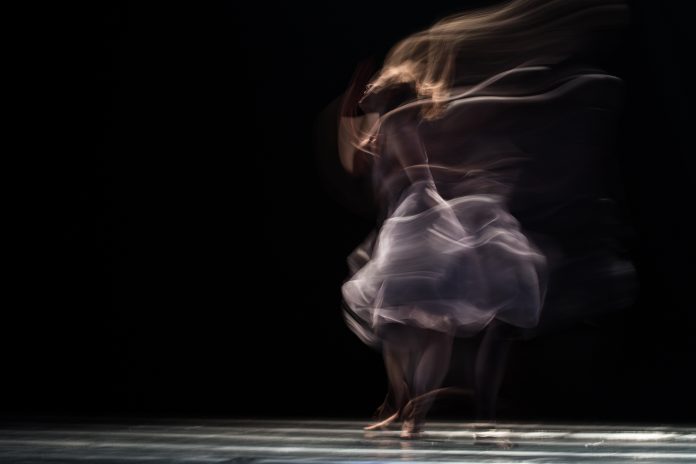 A person in a distorted dance movement to depict the relationship of proprioception and chronic pain.