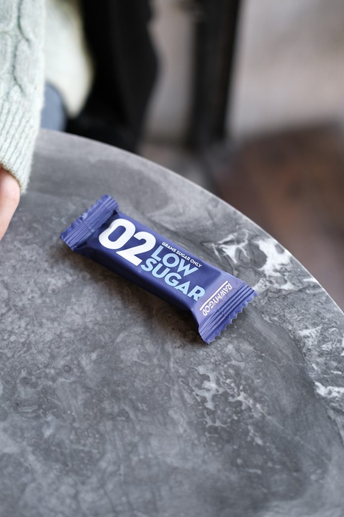 A candy bar that is low in sugar that would not help with the causes and symptoms of low blood sugar in those with type 1 diabetes.
