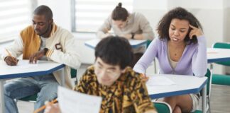 Photograph of a group of students in a classroom.